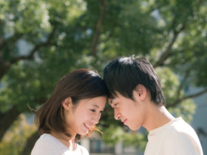 Young couple moving their face closer